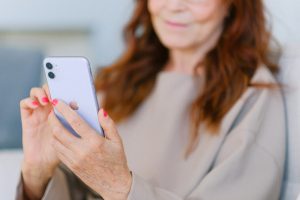 woman scrolling through phone